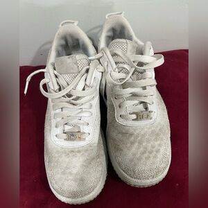 Nike Air Force Crater 1 Flyknit sneaker insole with frog tongue is Nike swoosh.